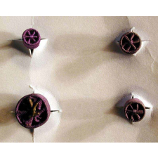 Carton de quatre rosettes d'Officier des Palmes Académiques.