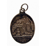Médaille religieuse à l'effigie de Notre-Dame de Lourdes. 