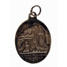 Médaille religieuse à l'effigie de Notre-Dame de Lourdes.