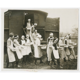 Gloucestershire. A classroom on theels. A caravan school room maintained by the Gloucester Education Committee for teaching domestic science to children in the villages is at present at Westbury on Severn where it will remain for some time to enable the chidren to be taught how to manage a home. Photo shows- Girls off for a lesson in laundry work in the open air at Westbury on Severn. Fox April 8th.36