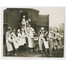 Gloucestershire. A classroom on theels. A caravan school room maintained by the Gloucester Education Committee for teaching domestic science to children in the villages is at present at Westbury on Severn where it will remain for some time to enable the chidren to be taught how to manage a home. Photo shows- Girls off for a lesson in laundry work in the open air at Westbury on Severn. Fox April 8th.36