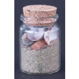 Pot avec sable et coquillages